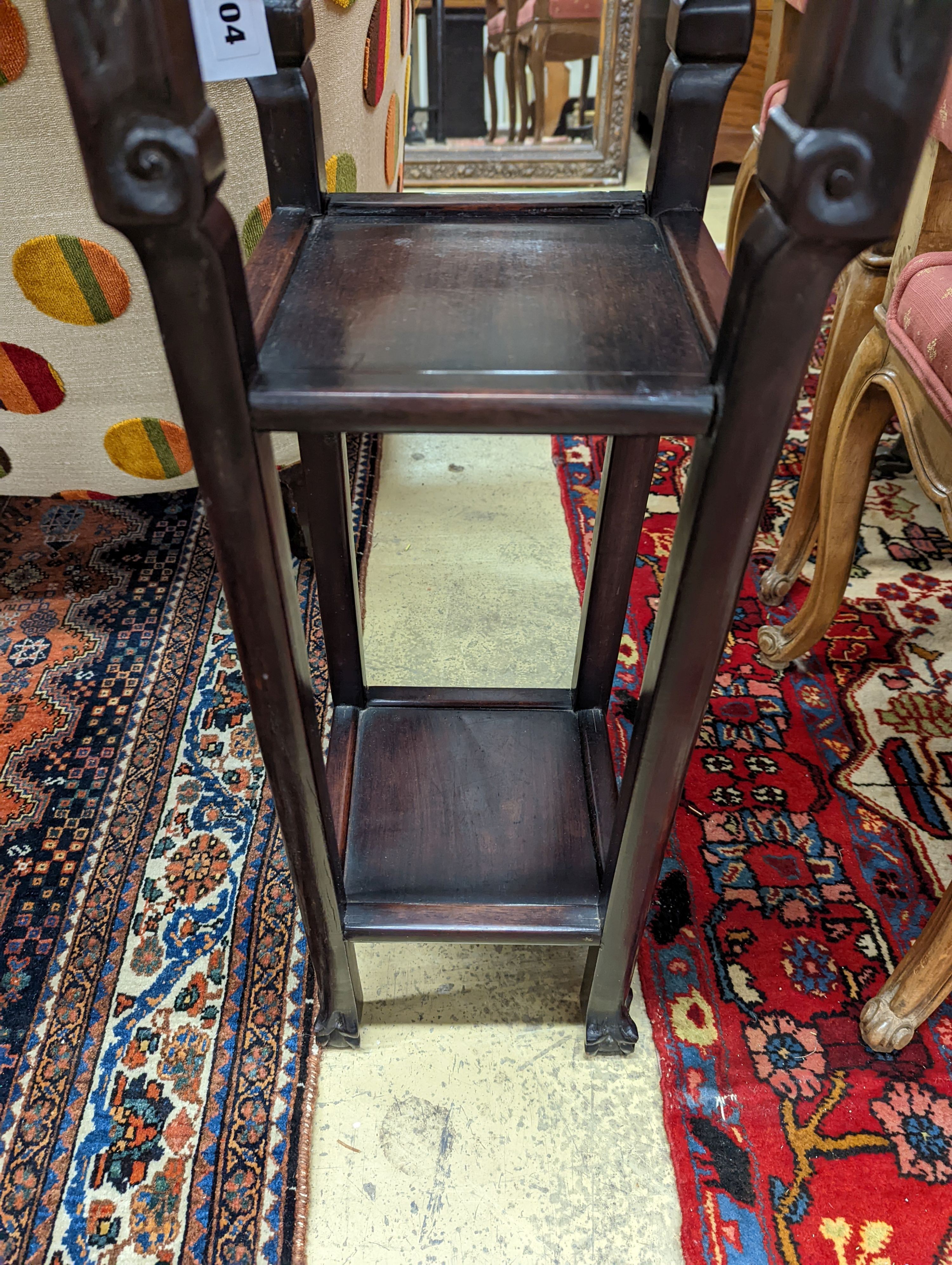 A Chinese carved hardwood three tier jardiniere stand, marble inset, width 22cm, depth 22cm, height 82cm